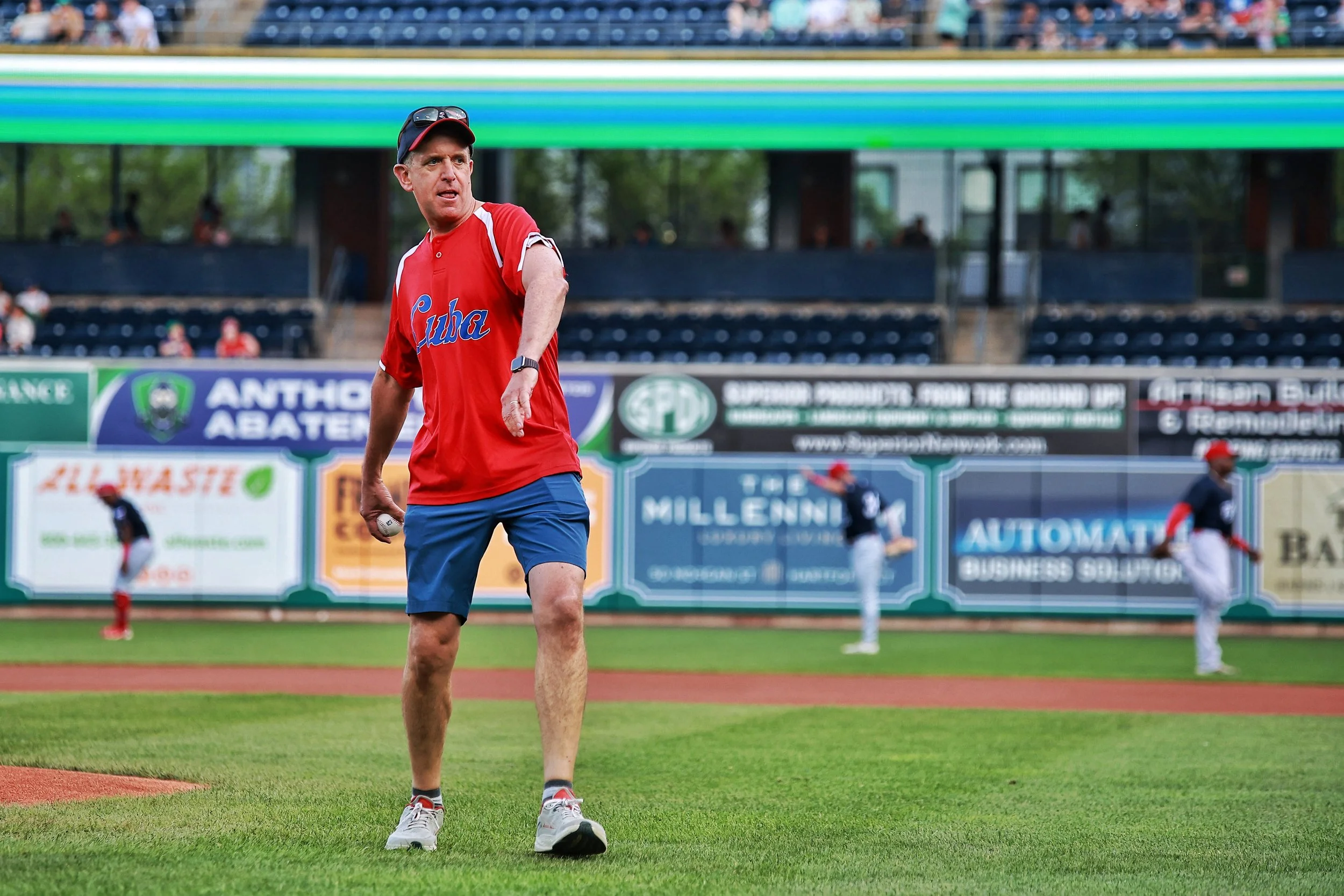 Tim Brennan throws one of the ceremonial first pitches prior to Cuban Heritage Night.| Credit: Reynaldo Cruz Diaz