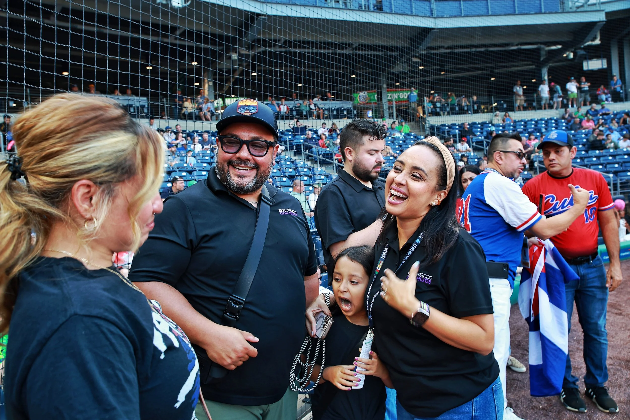 People celebrate on the field prior to Cuban Heritage Night.| Credit: Reynaldo Cruz Diaz