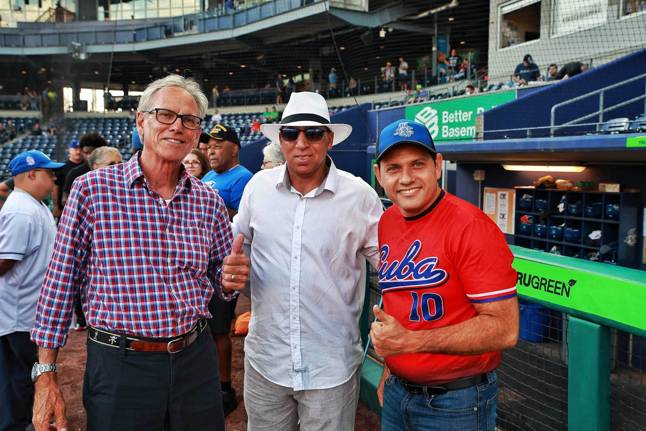 John Wenz, Karel García and Yasel Porto pose for a photo prior to the game on the Cuban Heritage Night.| Credit: Reynaldo Cruz Diaz