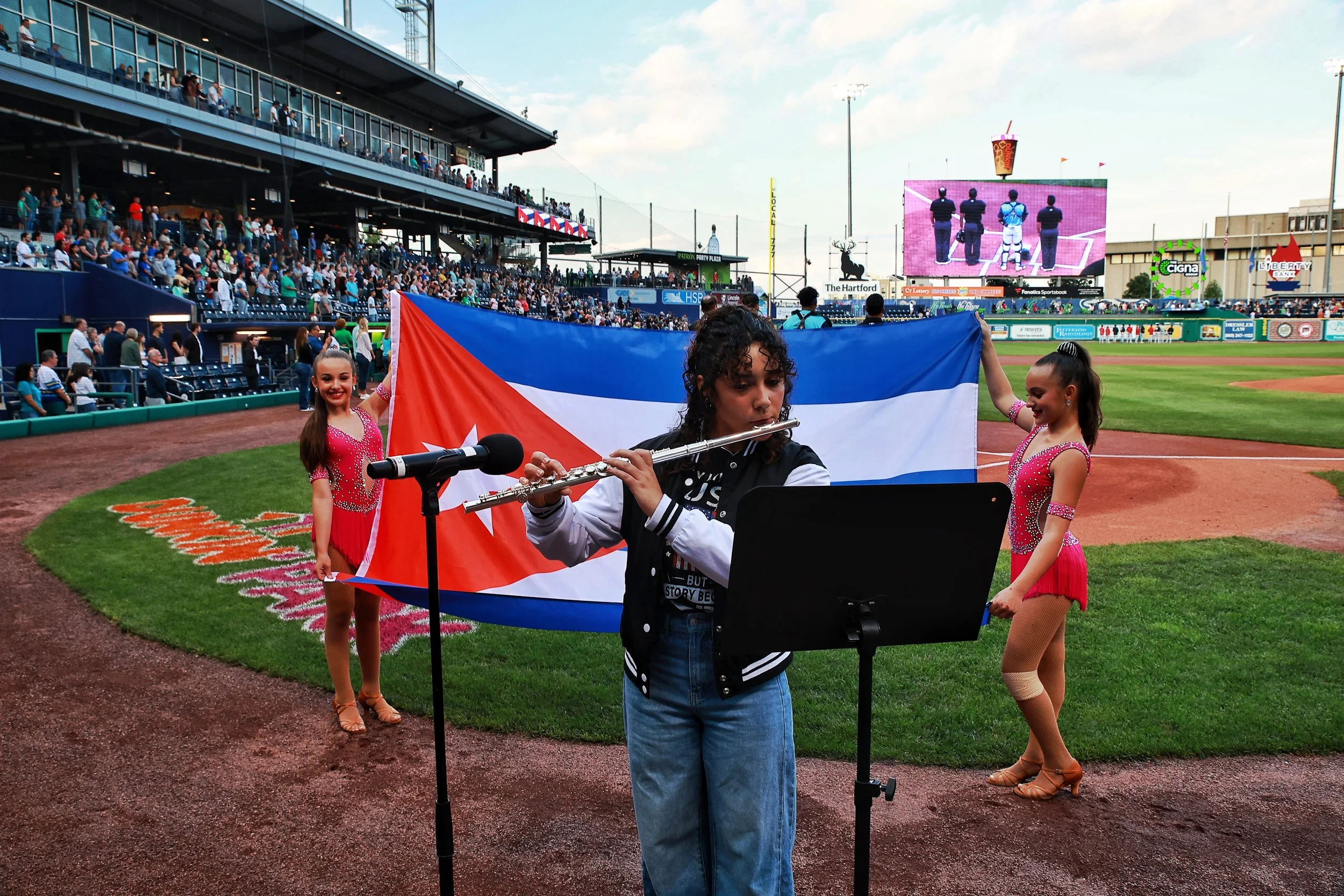 Ana Paula Palacios Díaz plays the Cuban National Anthem on the flute prior to Cuban Heritage Night.| Credit: Reynaldo Cruz Diaz