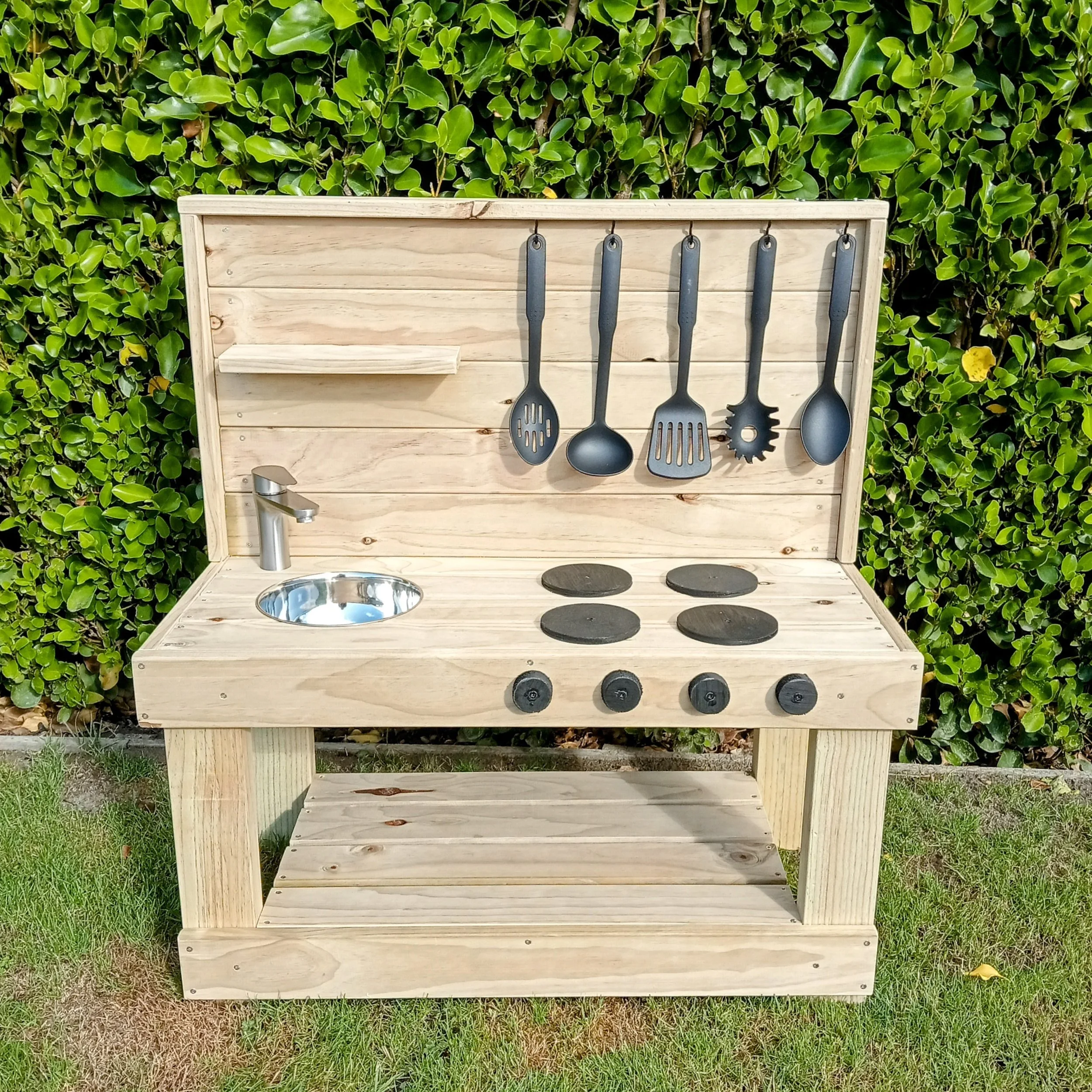 Sawdust & Co Mud Kitchen made in NZ featuring faucet/tap, hobs, knobs for outdoor play