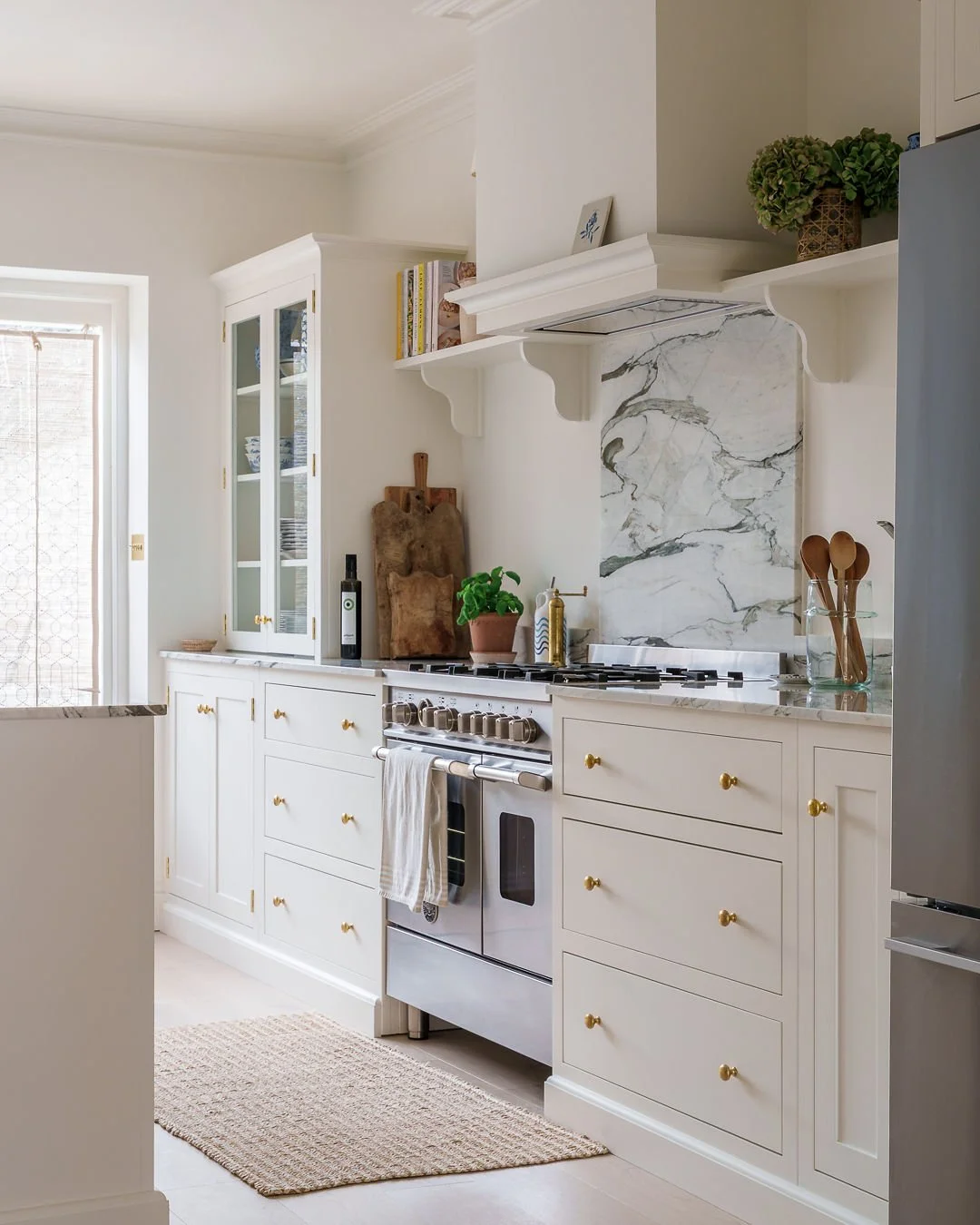 Cloud White cabinetry and counter top units and marble tops