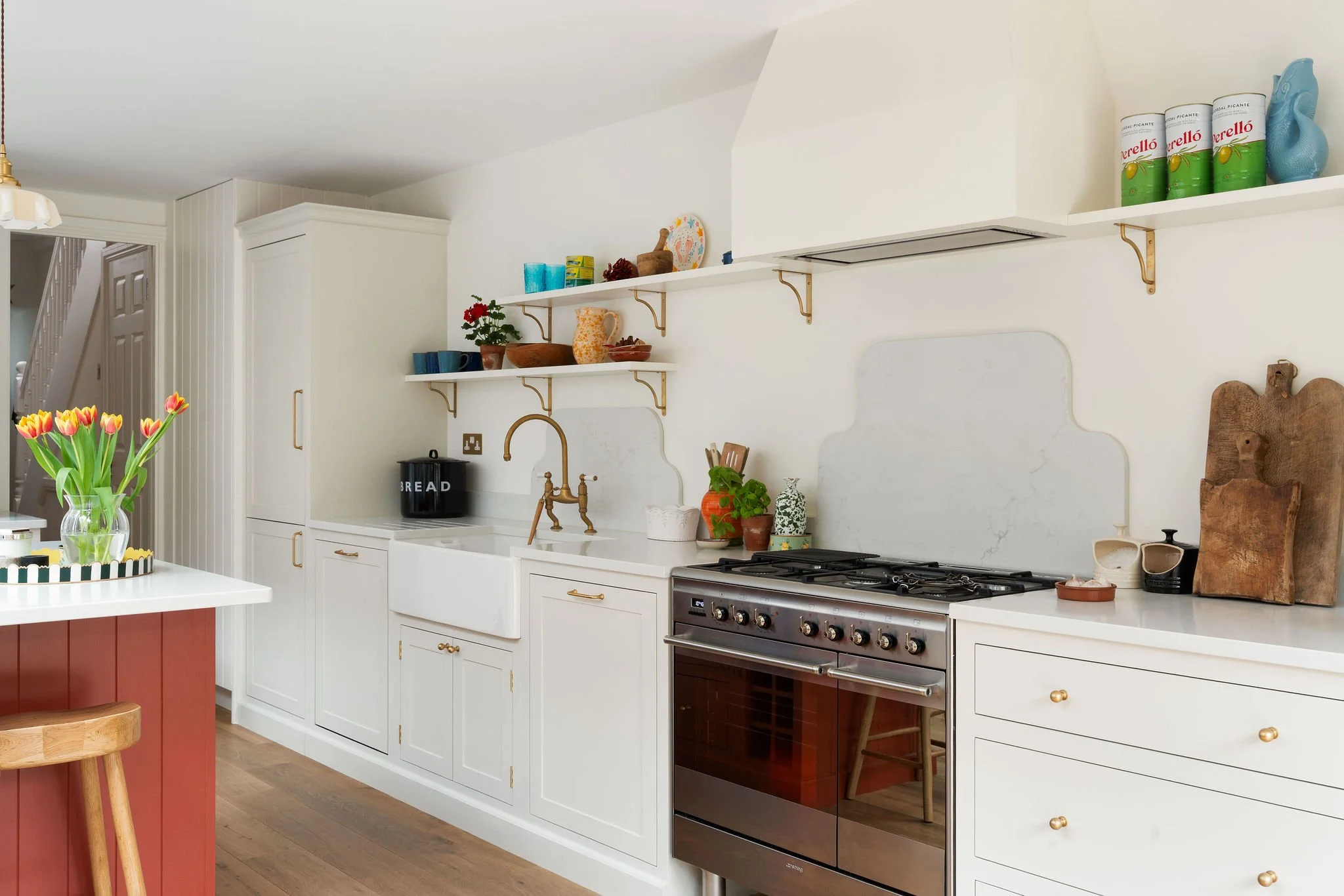 Long galley kitchen layout with warm tones and breakfast nook
