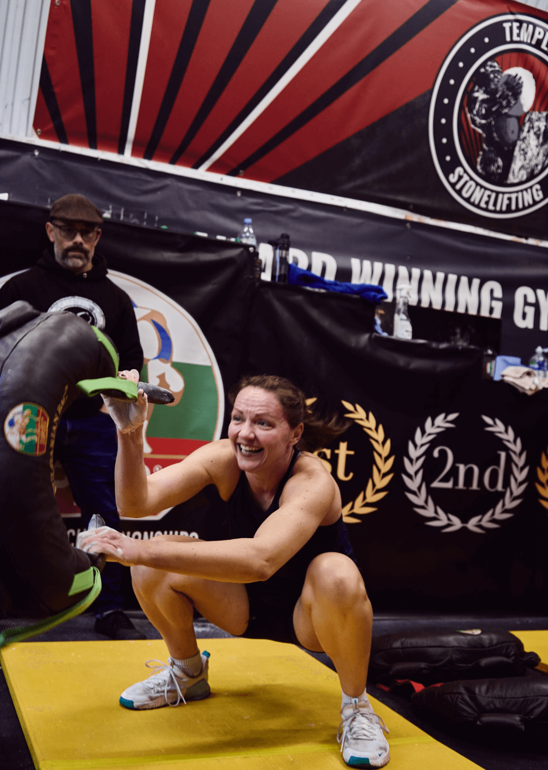 lady performing suples swing squat at the Bulgarian bag championships in London