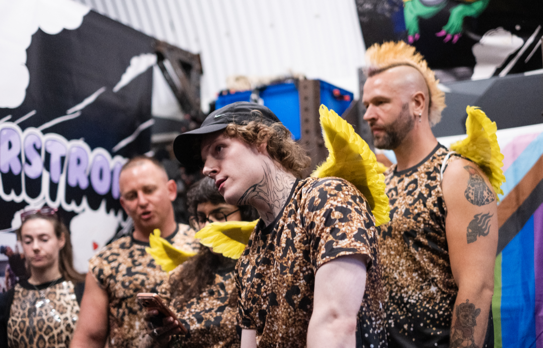 three referees in angel wings at Queerstrong London