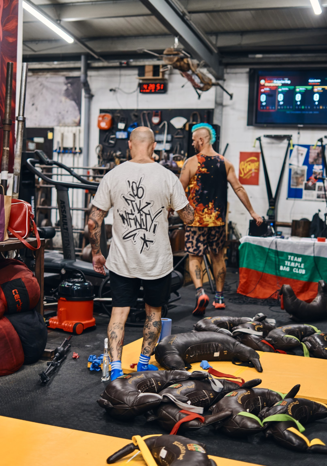 two men walking around setting up for Bulgarian bag Championships