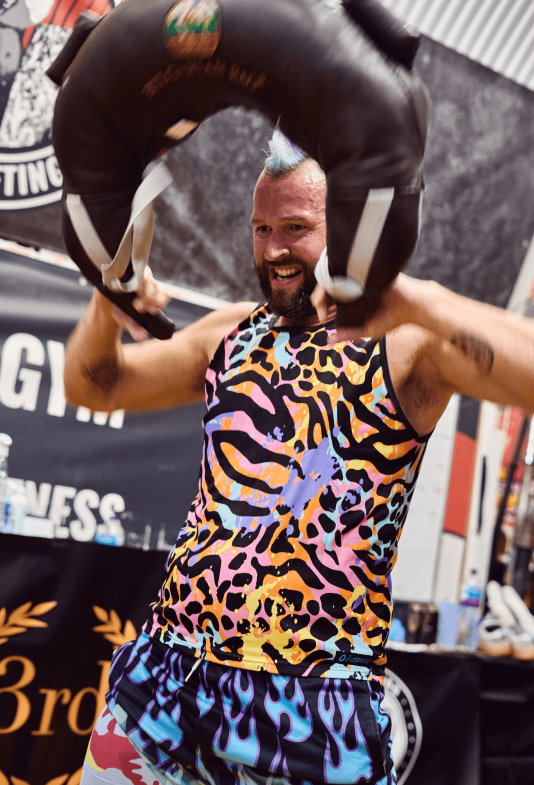 man with mohawk performing a snatch with a Bulgarian bag in London competition