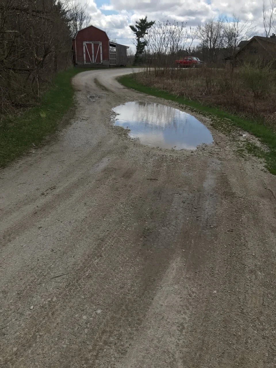 A gravel driveway before K-FEX repaved it