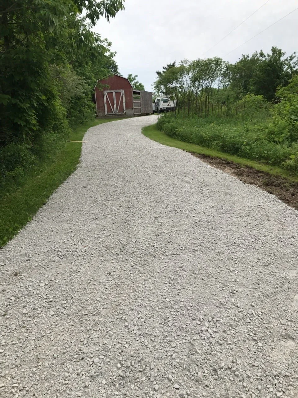 A gravel driveway after K-FEX repaved it