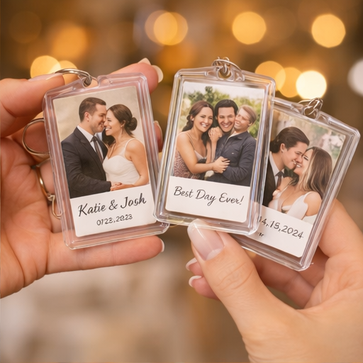 Personalized clear acrylic photo booth keychain featuring a vertical three-photo film strip of a smiling couple.