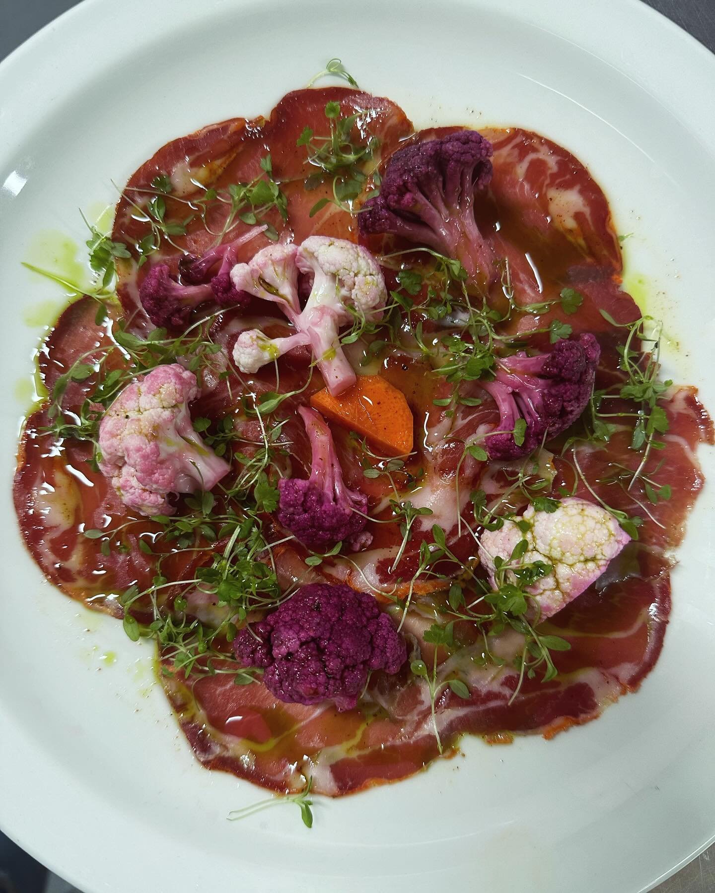 New dish Alert ‼️ 

Capicollo Cured in spiced Paprika topped with Pickle cauliflower &amp; purple Cauliflower , Dressed with Condementa Extra virgin olive oil⭐️⭐️⭐️

Come and pair this dish with a glass of wine 🍷 

Book a table via the bio or call u