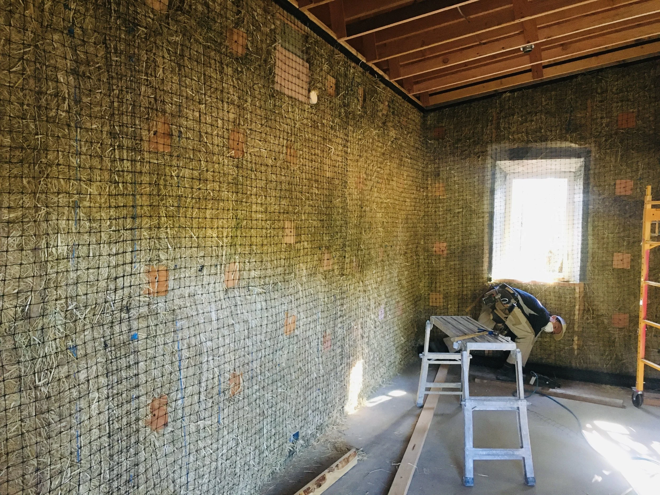 straw bale wall mesh for plaster prep.jpg