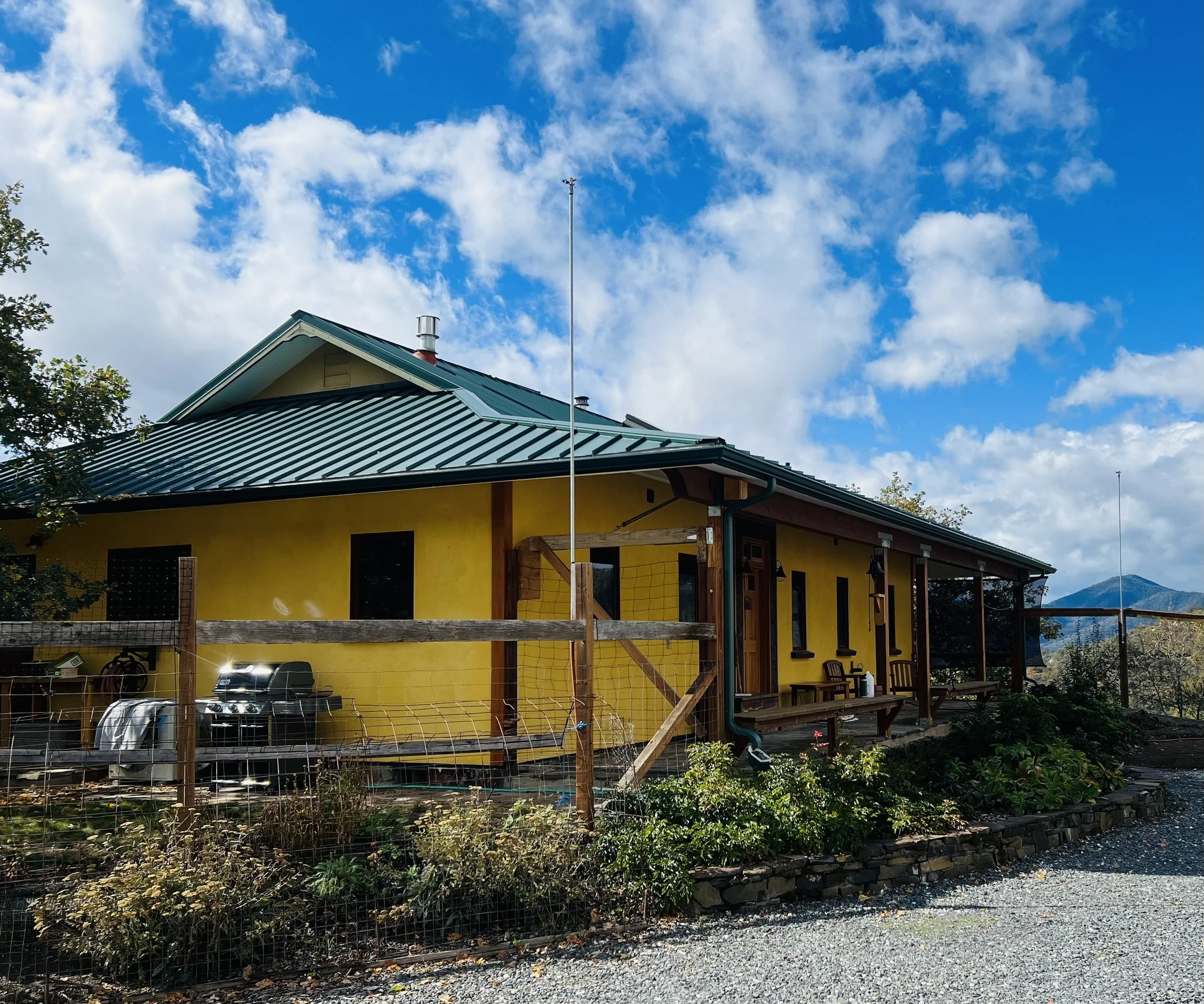 Straw bale home with bright yellow lime plaster.jpg