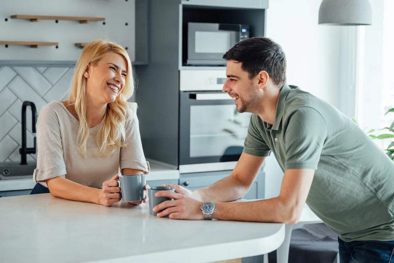 Couple face-to-face, not fighting and talking. The SHARE Model gives couples a 5-step framework for discussing hurt without causing more damage. Here’s how it works.