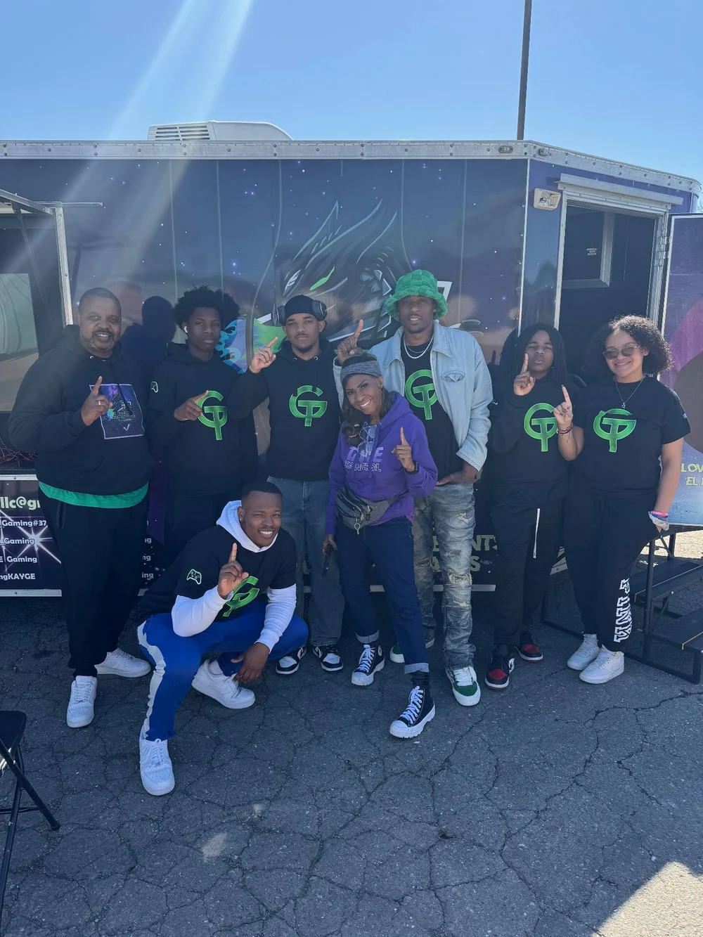 KAYGE team together in front of the gaming trailer