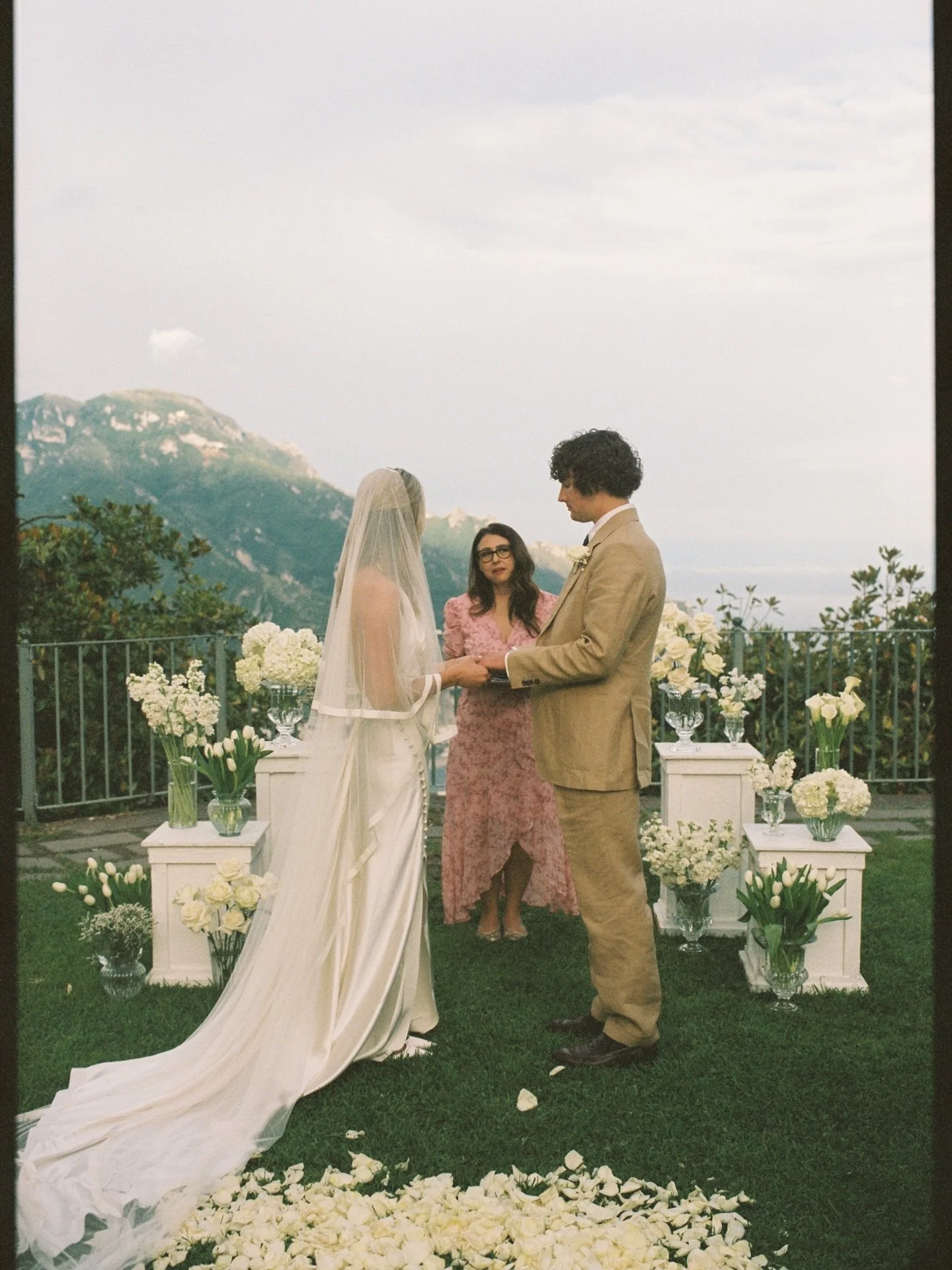 An intimate sunset ceremony in Ravello, overlooking the magnificent Amalfi coast, between mountains and sea. As always, captured on 35mm and 120 film.

Film wedding photographer @sarahjoylandon 
Wedding planner @amalfisoiree 
Getting ready venue @vil