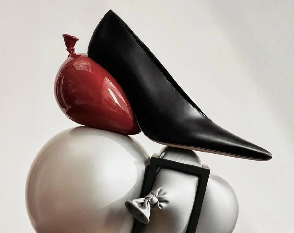 Surreal Loewe product campaign showing sculptural shoe and fashion objects