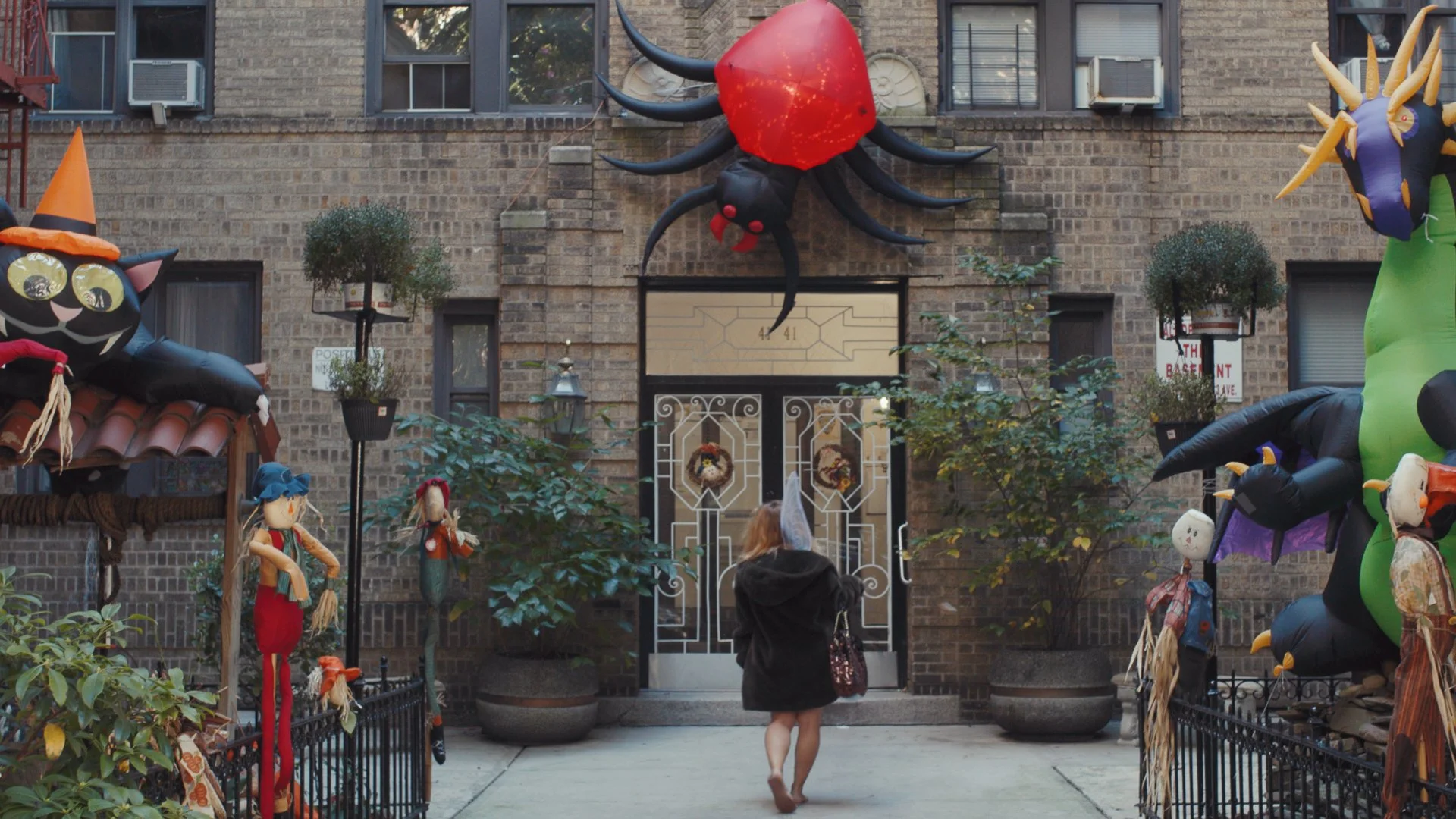 FT_Wide of Sam entering building.jpg