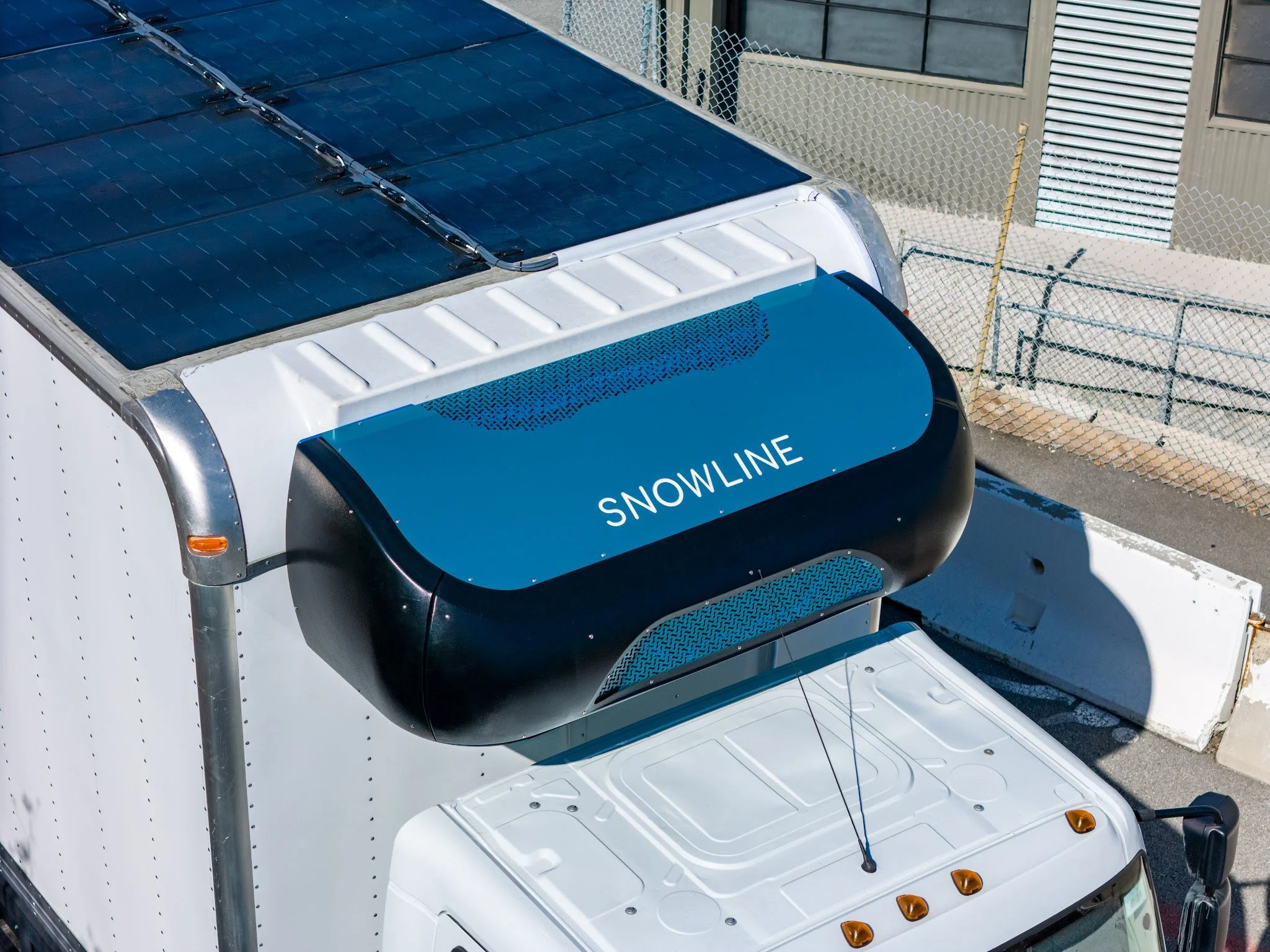 A Snowline smart electric transport refrigeration unit mounted to a last mile delivery truck