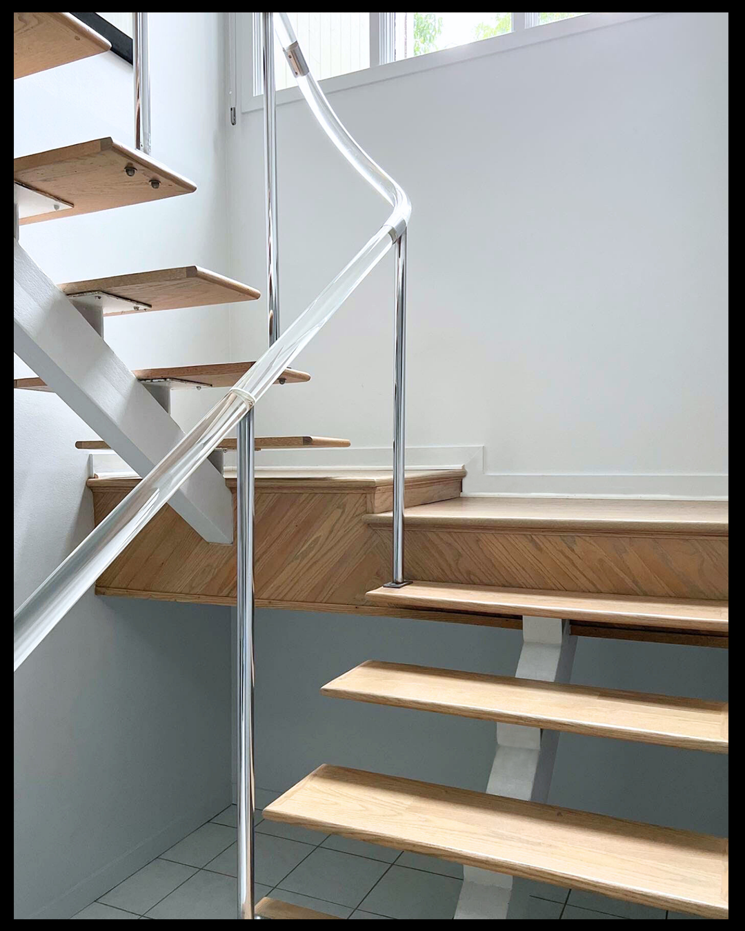 custom stairs with lucite railing.png
