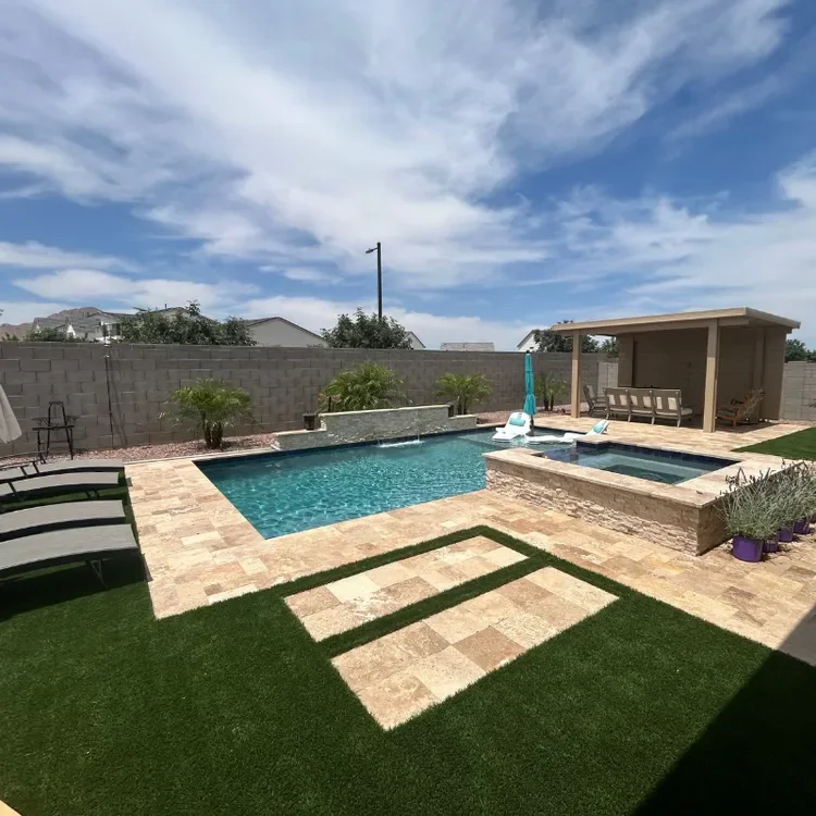 Swimming Pool with Pergola, Travertine, and Turf