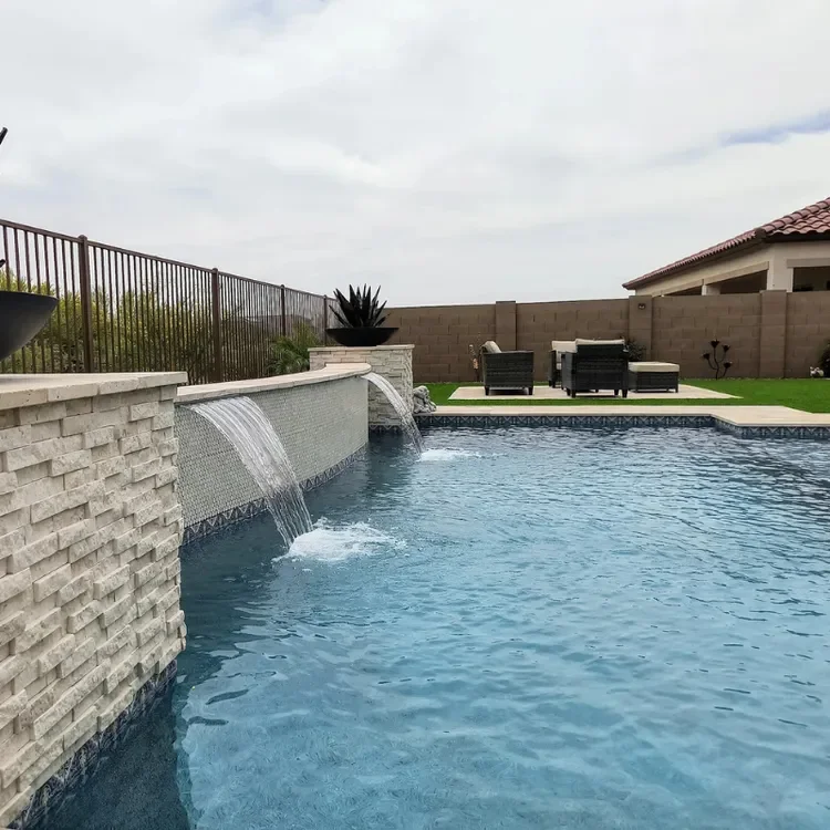 Gallery -Water fall featured custom swimming pool.