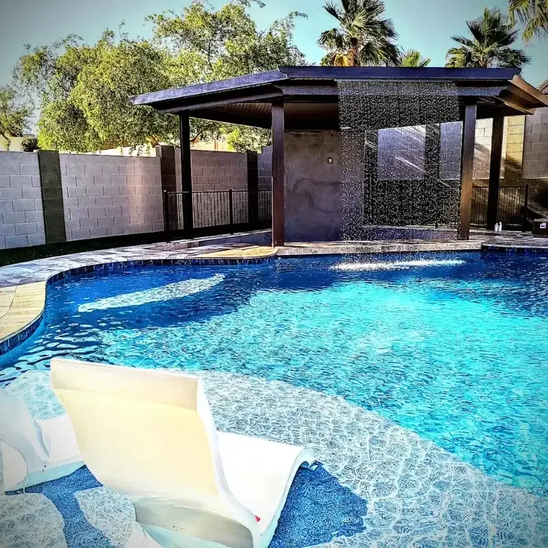 Gallery -  Swimming pool seating with a water-featured ramada on a Phoenix, AZ dayy.