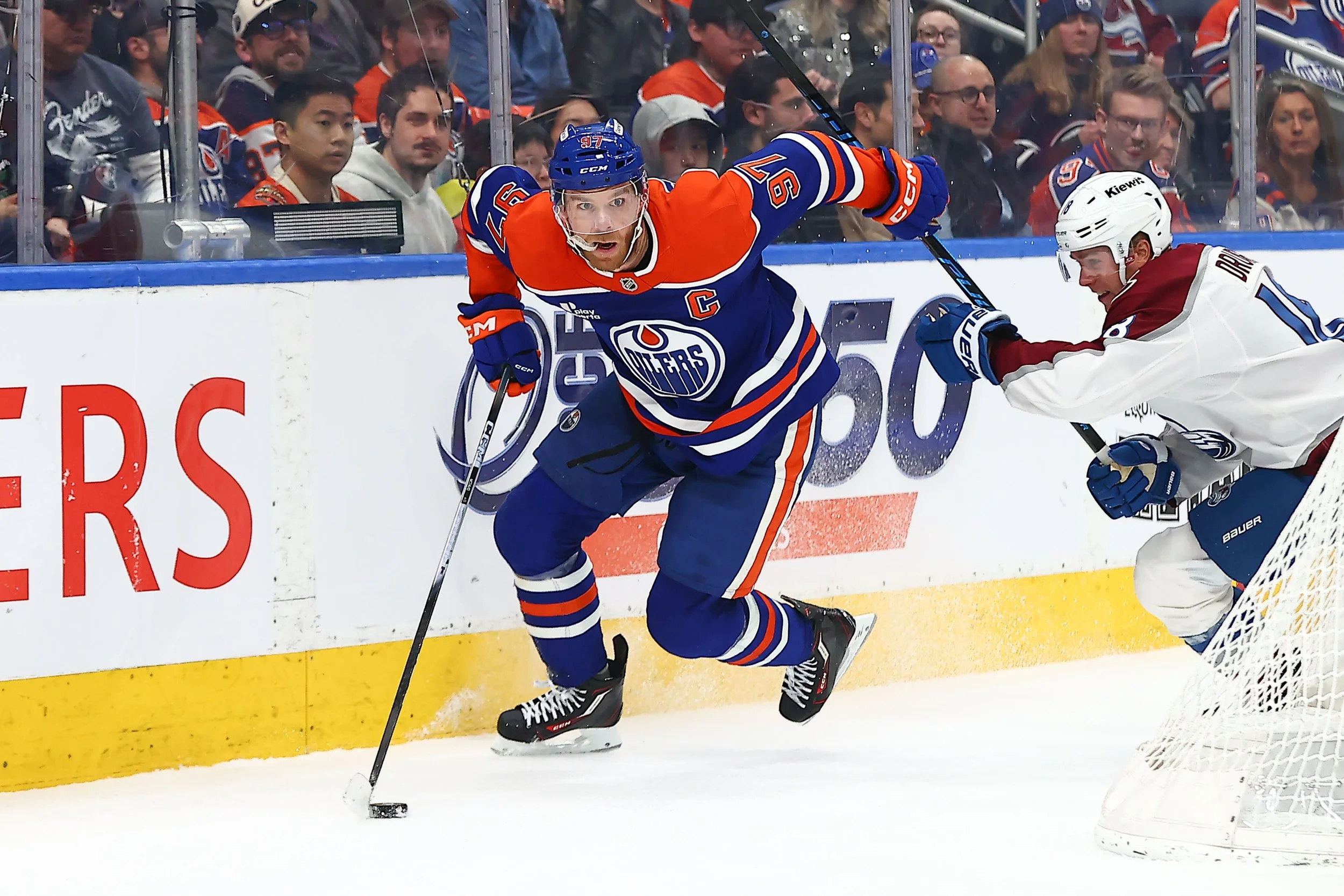 Connor McDavid skates the puck photographed by Edmonton Photographer Curtis Comeau 