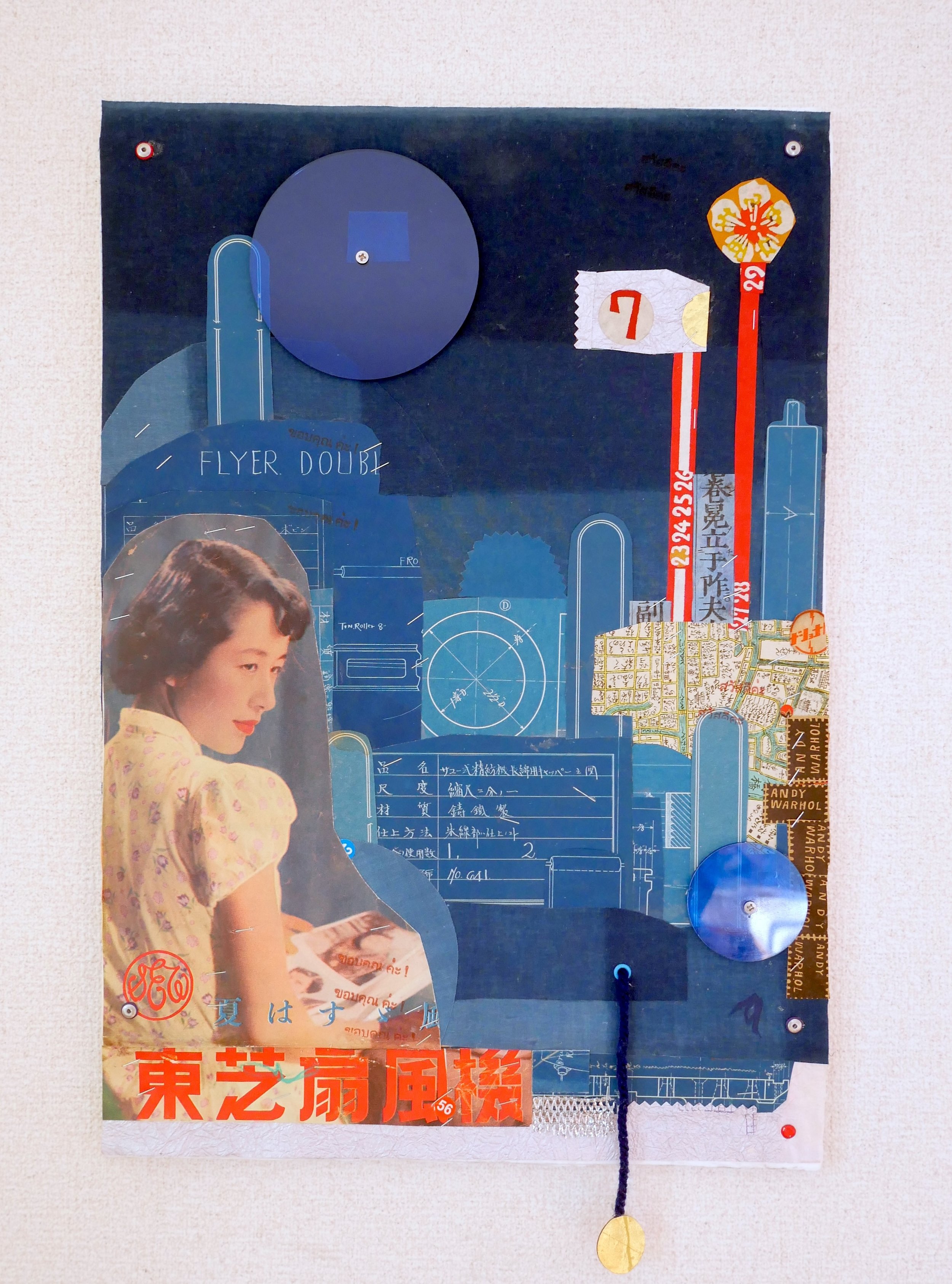 TOSHIBA FLYER, 2026.  Vintage Japanese blueprints, maps & papers, indigo fabric, metal, plexi and string on multi layers of extra-thick handmade paper.  33.5x52x1cm / $245.00