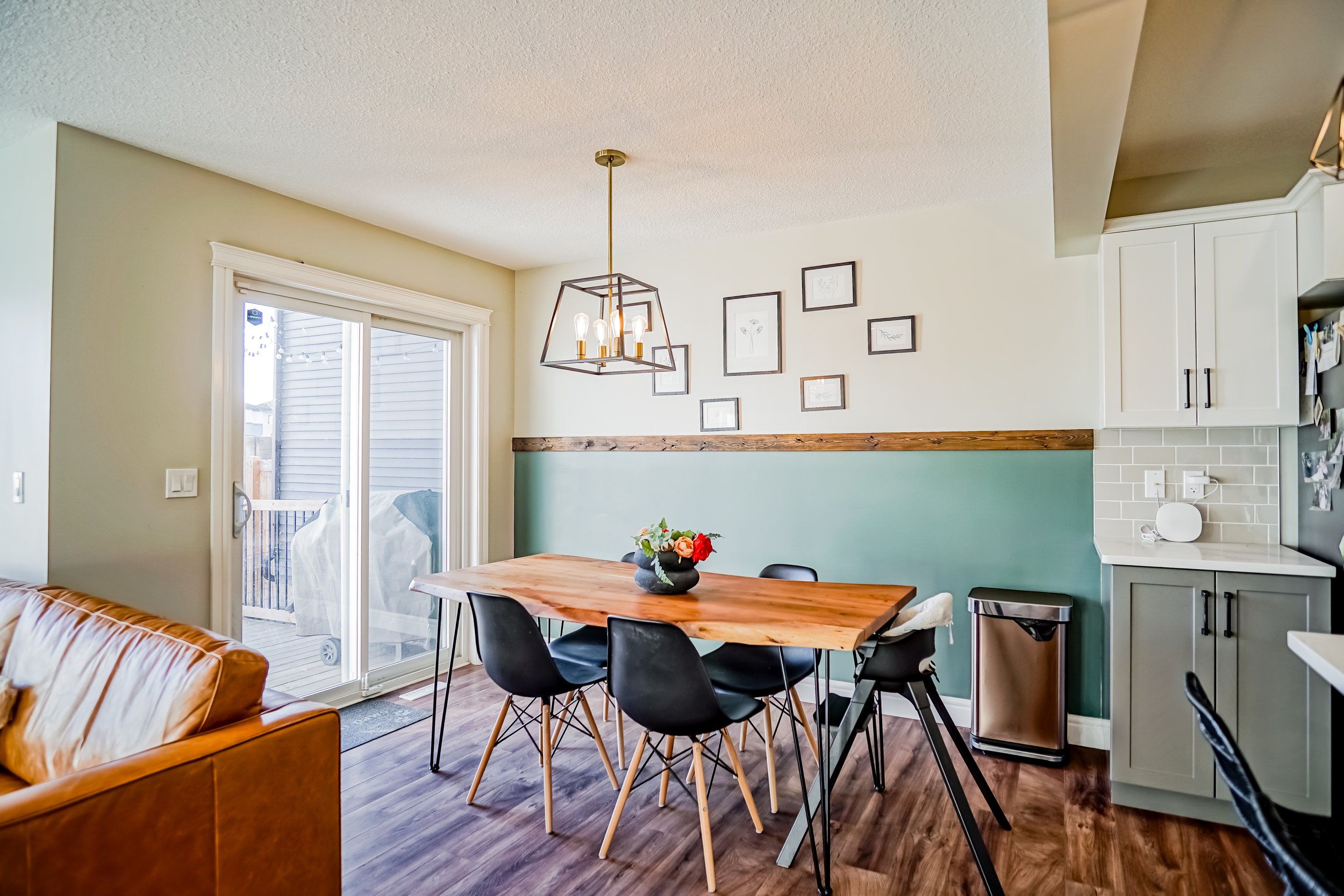 a dining area with open concept kitchen