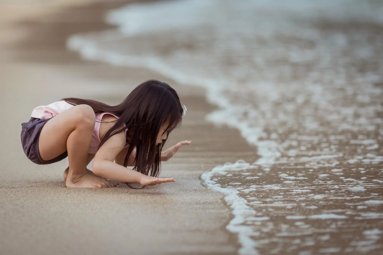 Outdoor family photoshoot at a secret Hong Kong beach