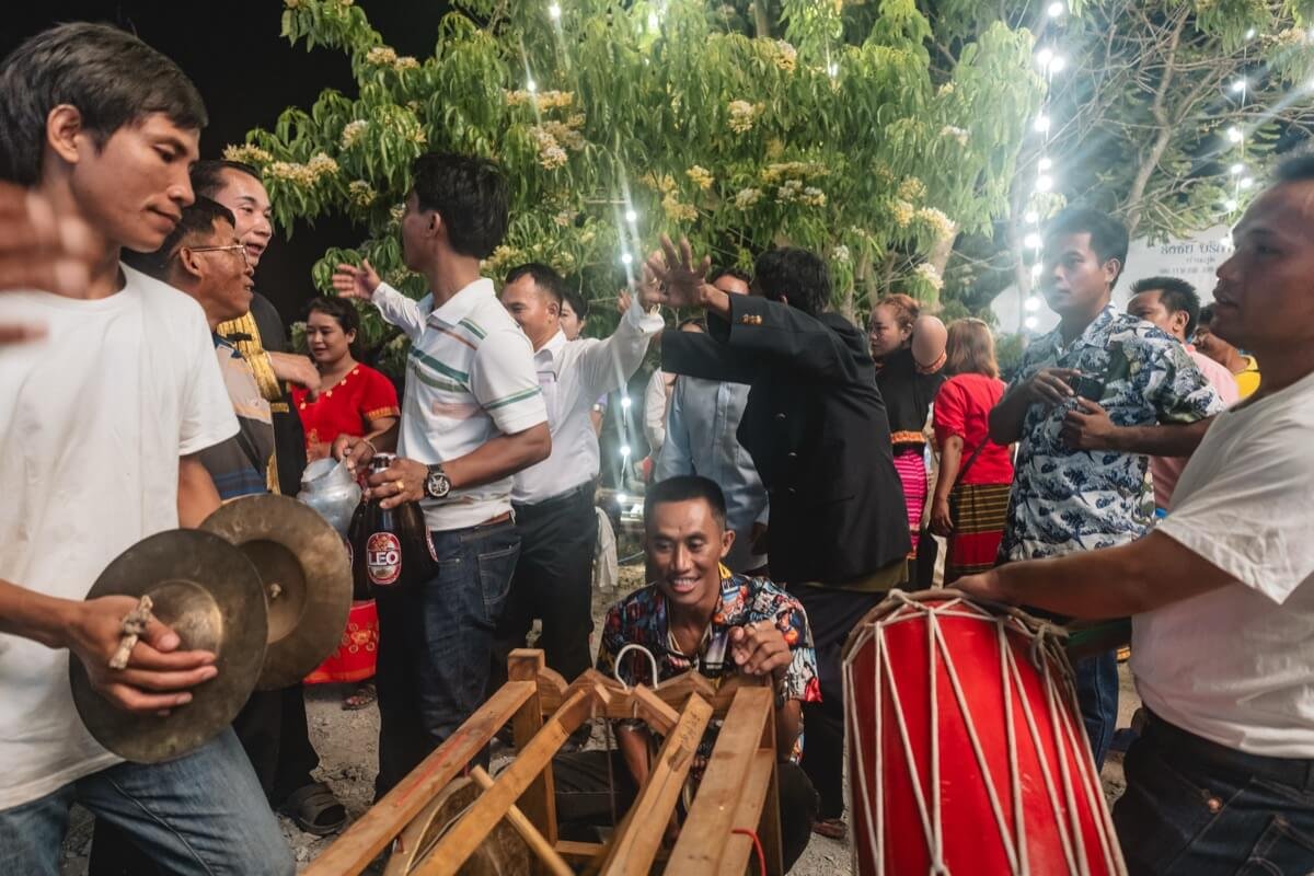 Playing a large percussion instrument.