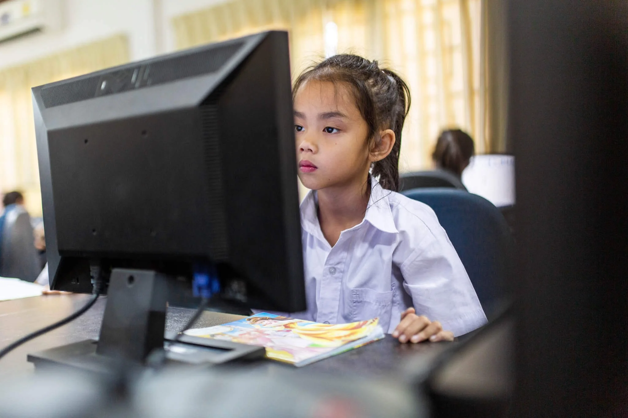 Girl at a school on the site of THPC | CSR Photography Asia