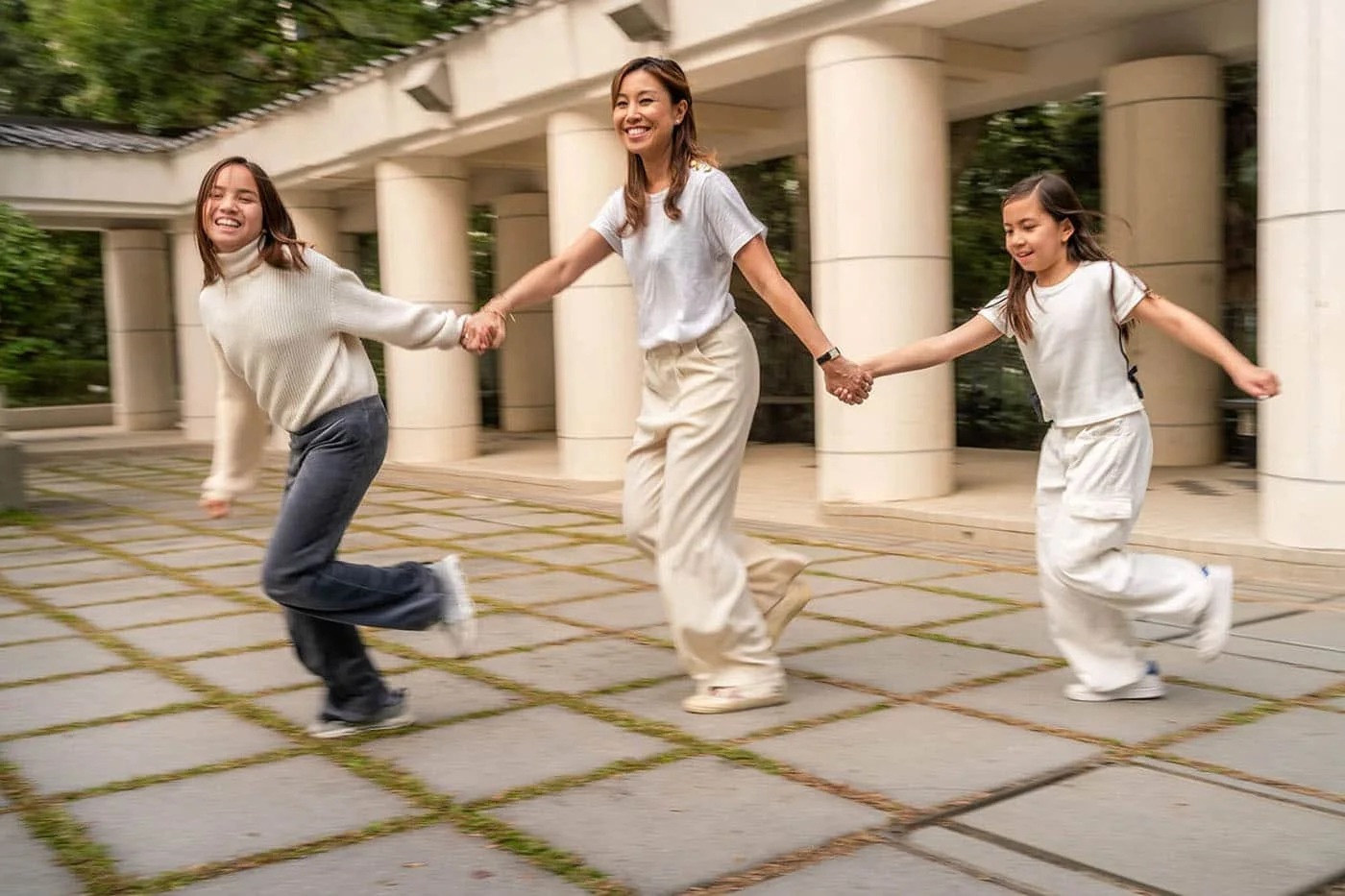 mom and daughters run at Hong Kong Park