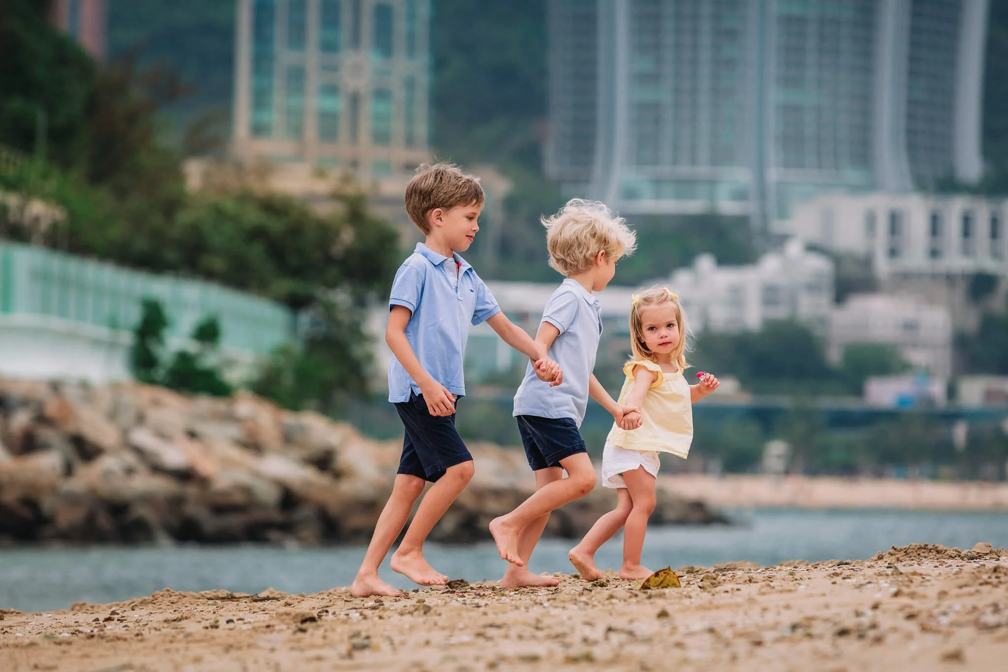 Siblings on the beach at Royal Hong Kong Yacht Club