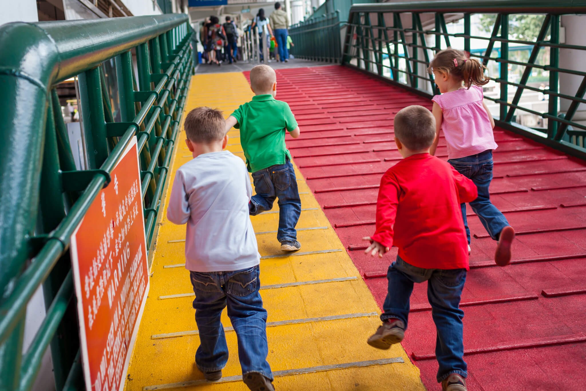 Documentary stye family photo shoot in Hong Kong with two set of twins on the Star Ferry