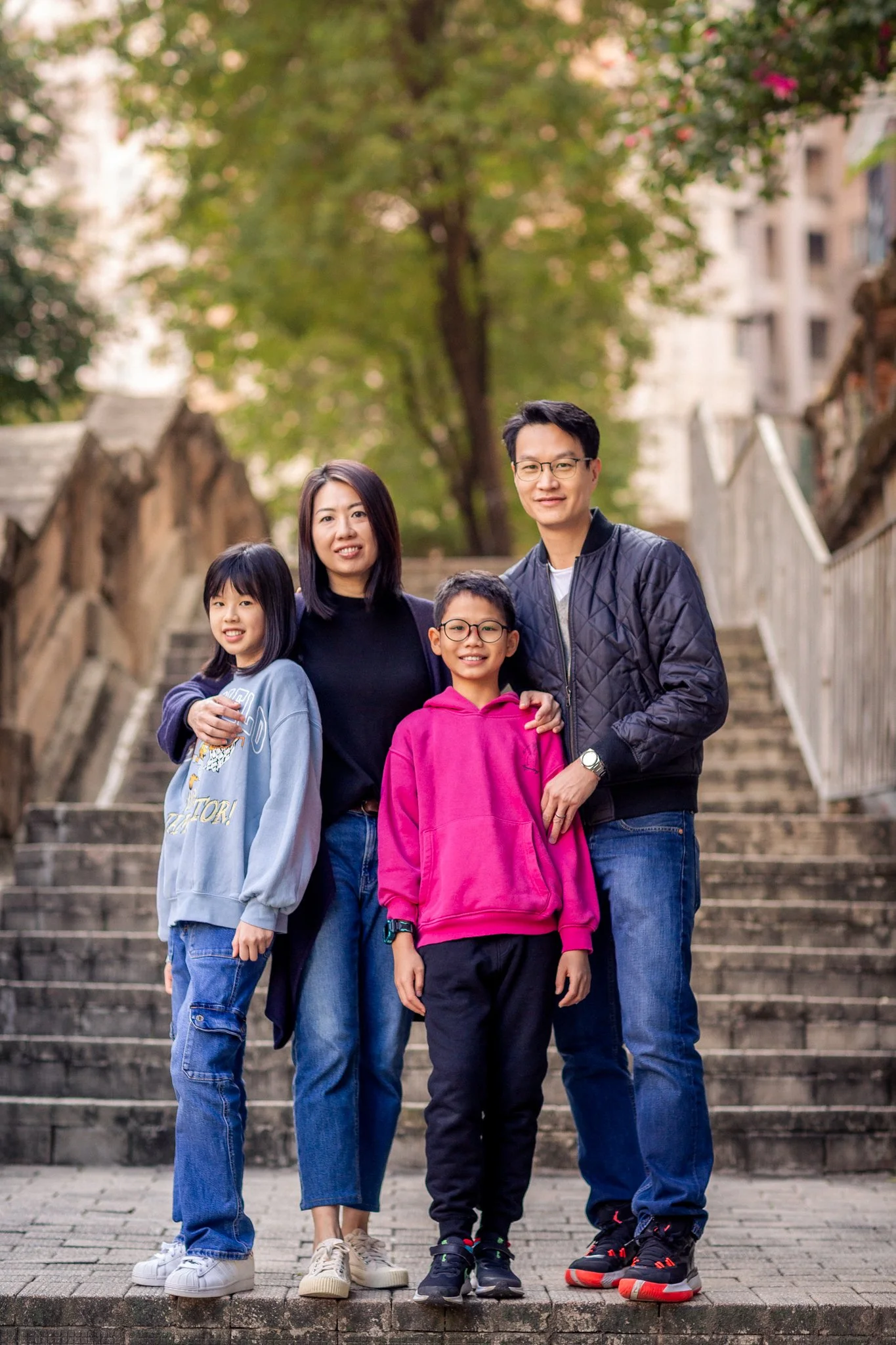 Family posing on the stairs in Sheung Wan Hong Kong