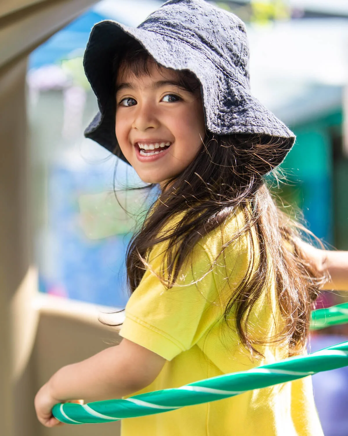 Girl plays with a hula-hoop, documentary kids photography Hong Kong