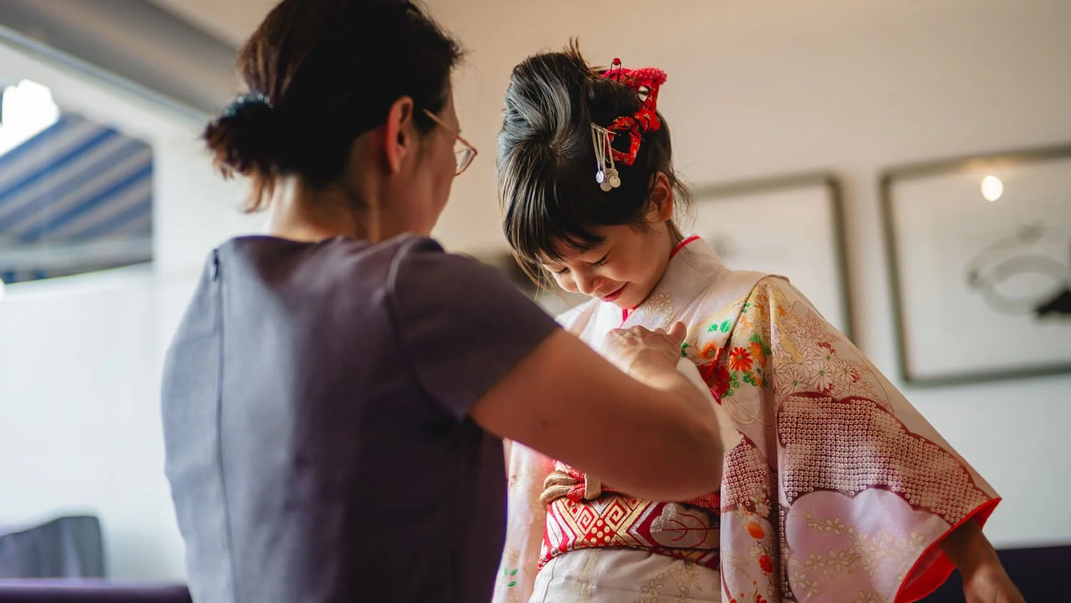 Grandmother helps with the kimono