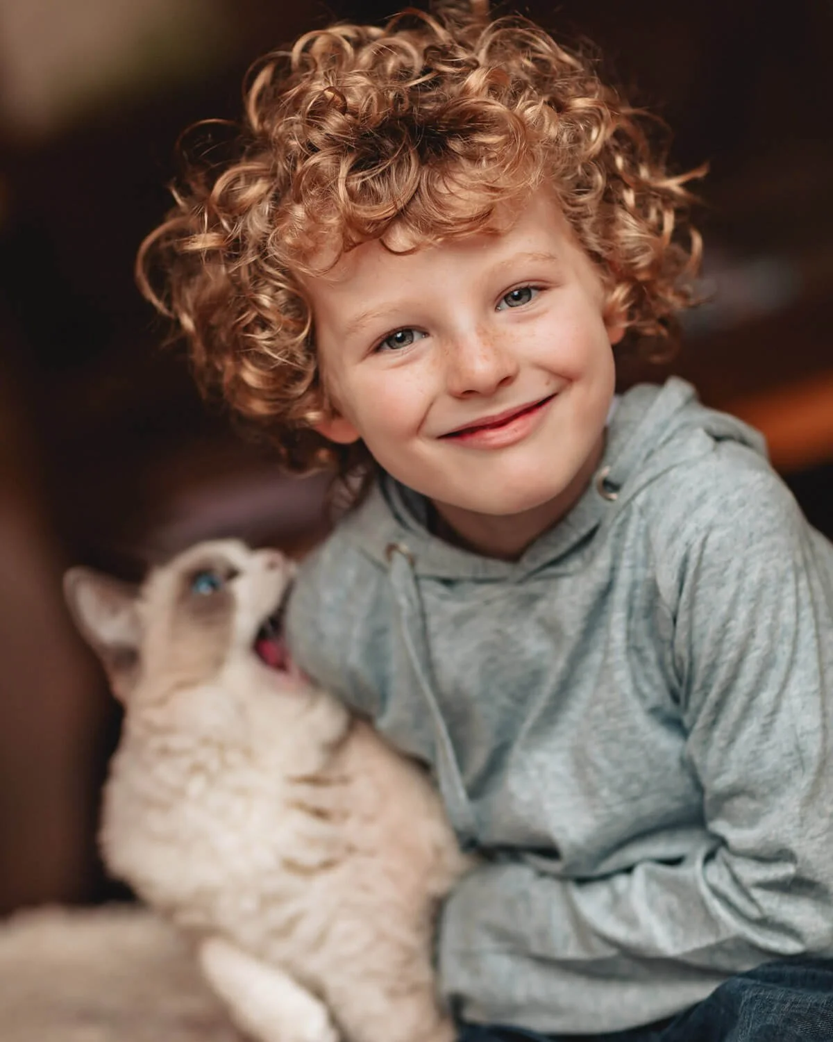 Cat bites boy on a kids photoshoot in hong kong