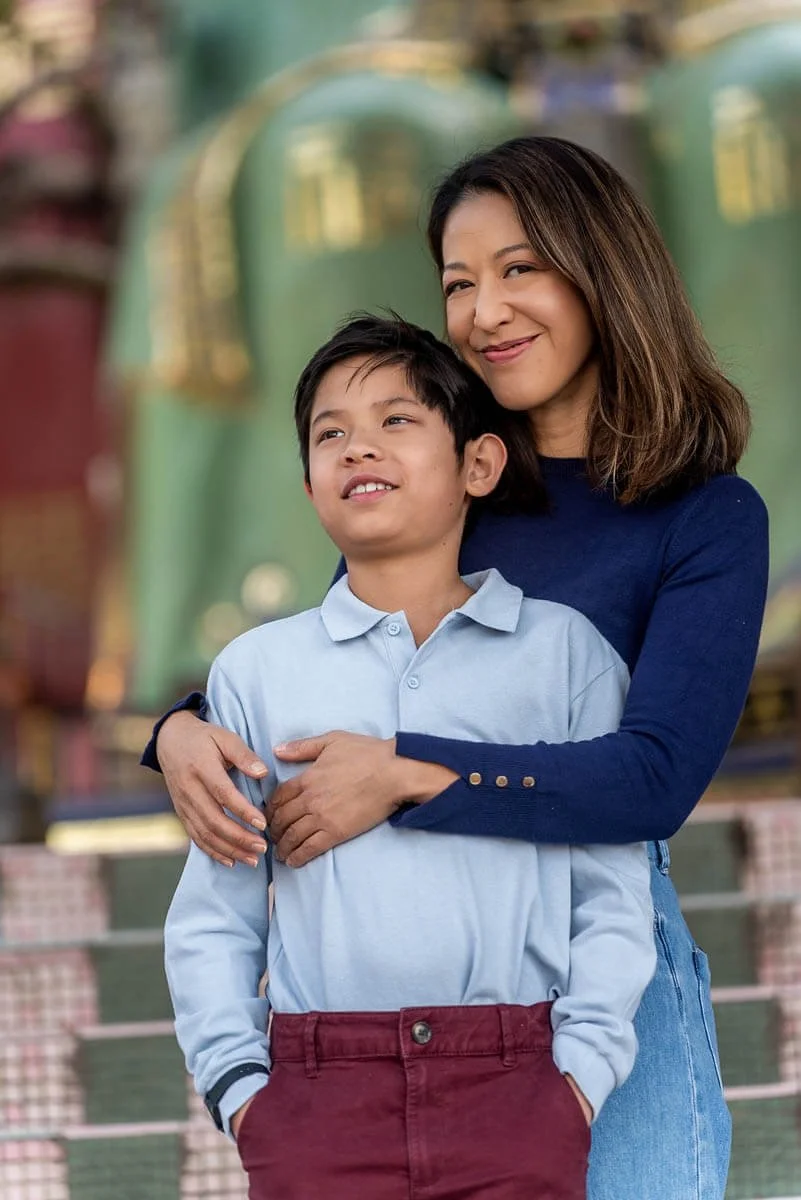 Mom hugs son at Repulse Bay Beach, Hong Kong