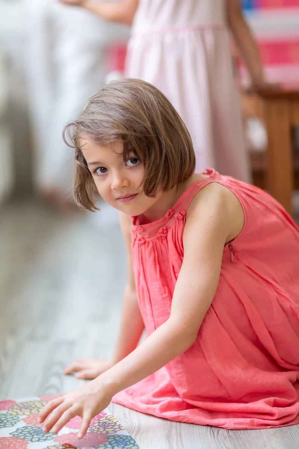 Toddler practicing Montessori practical life skills in a Hong Kong school; unposed photography for school marketing and branding.