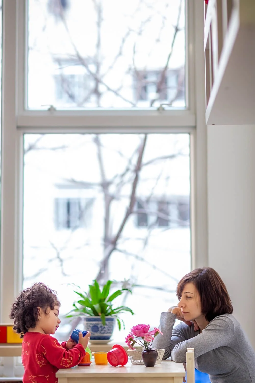 A Montessori mom observing her daughter in a Hong Kong international school; professional imagery for school branding