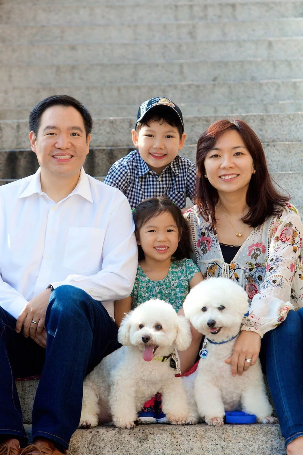 Family sitting on stone steps in Stanley, Hong Kong