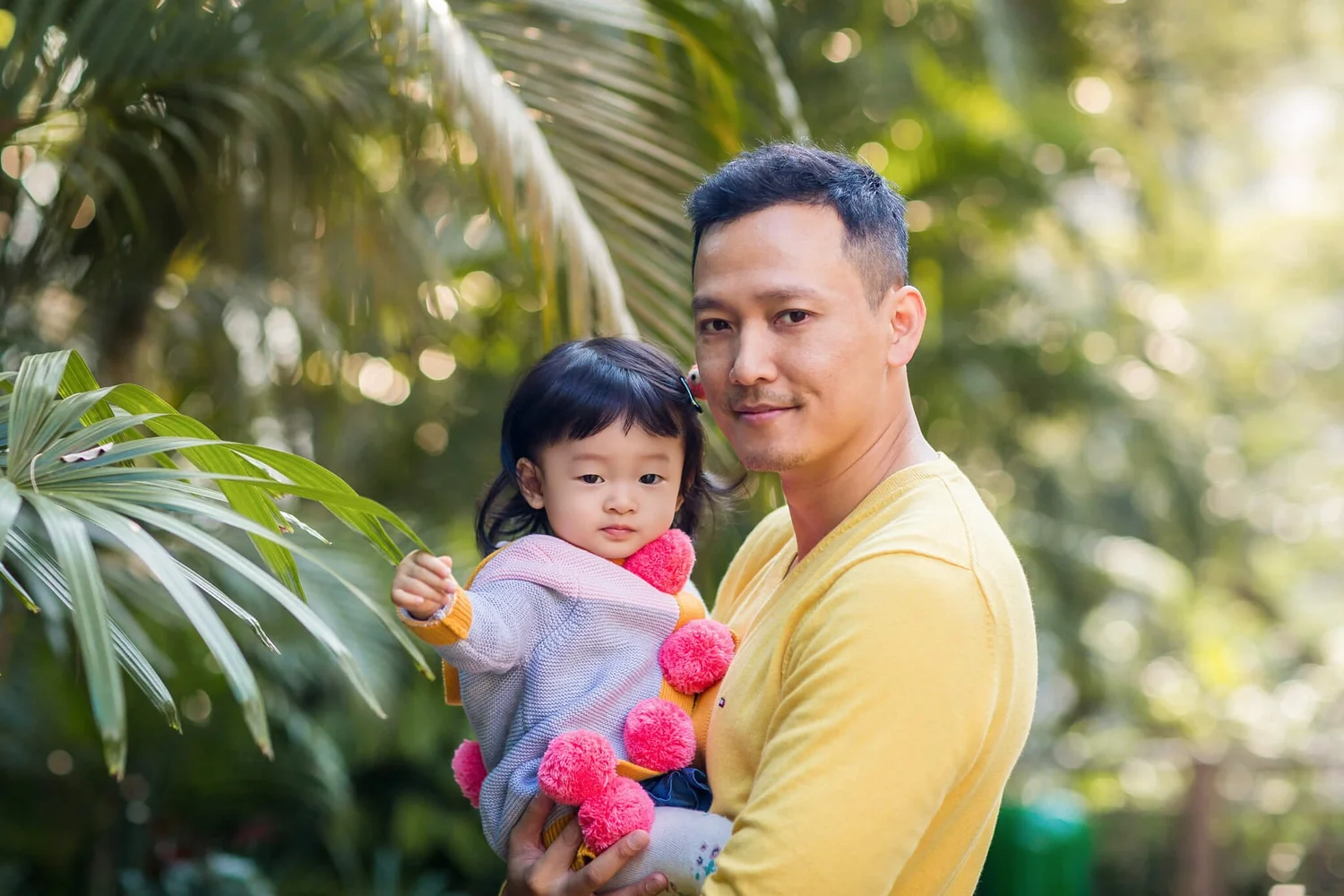 Dad holds daughter at The Botanical Garden HK