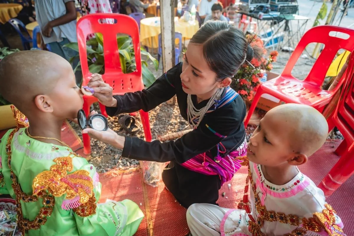Lua boy's mom helps with makeup.