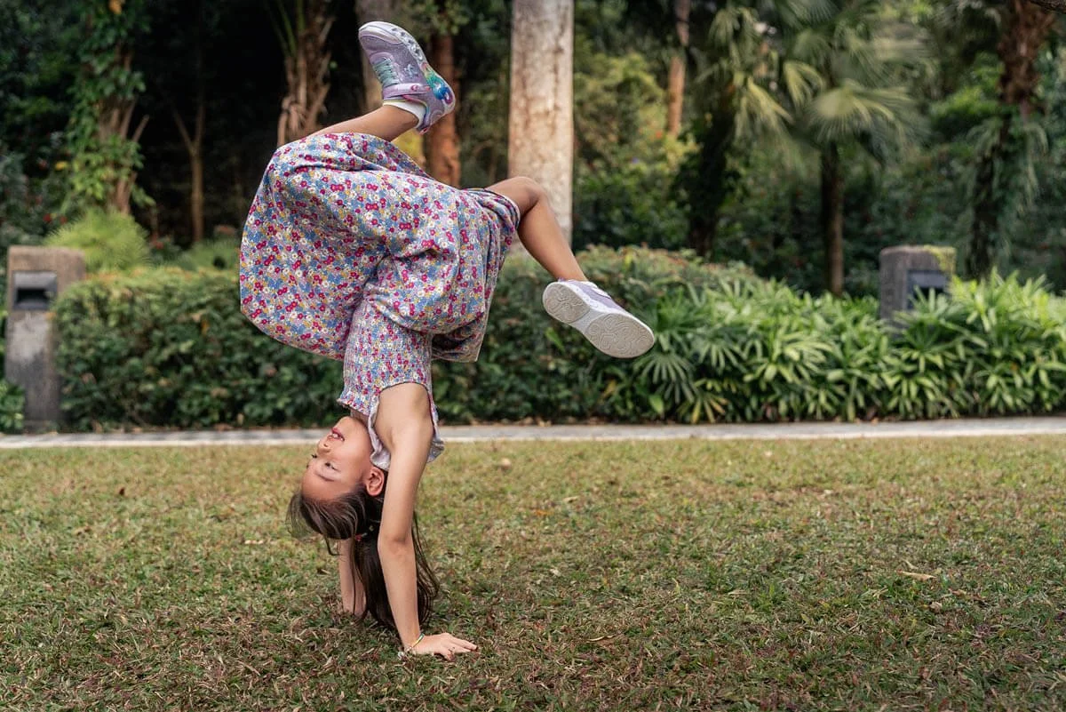 Girl does a handstand during a photoshoot at The Peak, Hong Kong