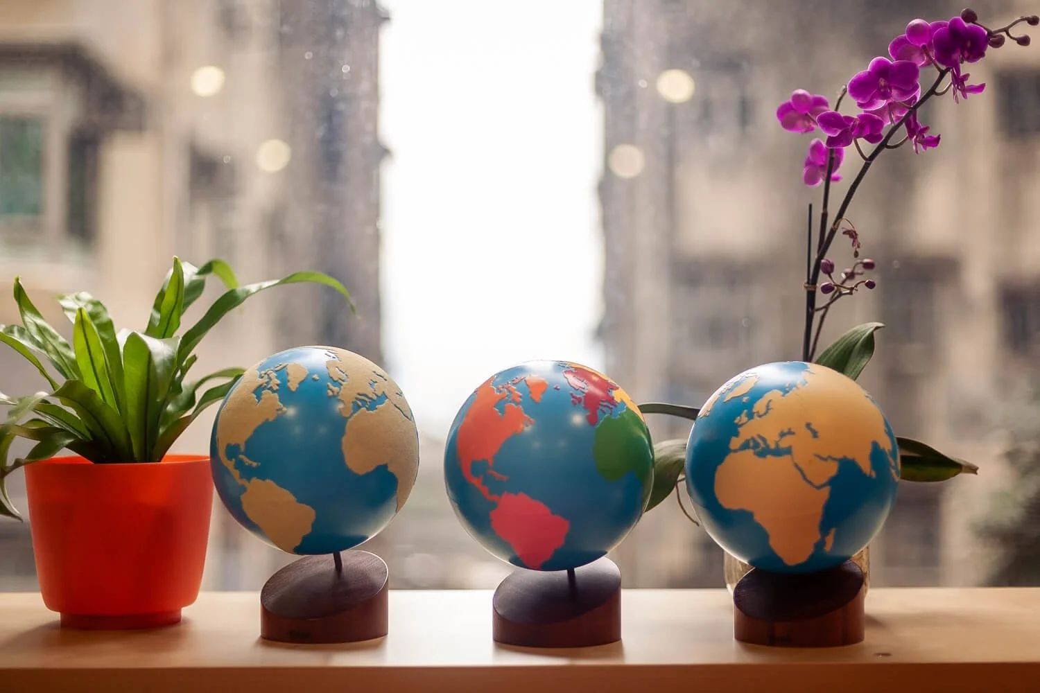 Three Montessori globes in a window, Hong Kong