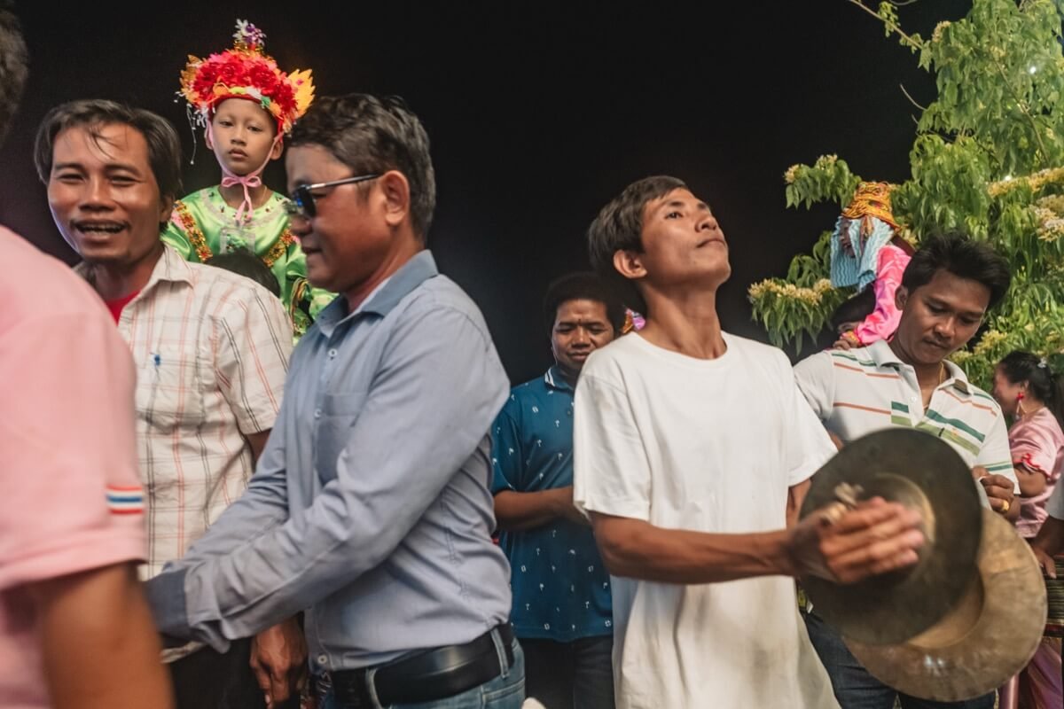 Boy on shoulders as music is played