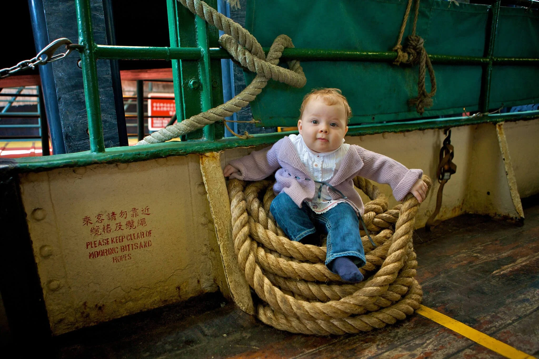 Toddler on the Star Ferry on a location family photoshoot in Hong Kong